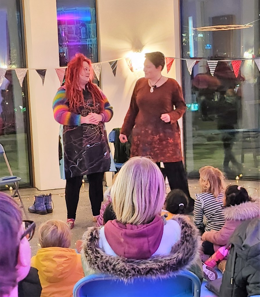 Pauline Cordiner and Lindsey Gibb tell stories at Spectra Light Festival 2023.

Pauline and Lindsey are looking seriously at each other. Perhaps a tense moment in the story?